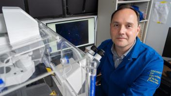 A photo of Neil Hunter in his lab. 