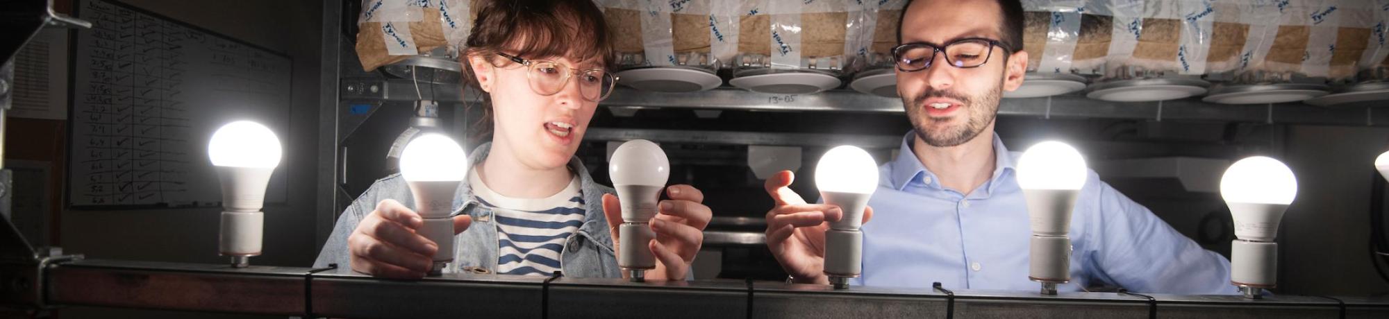 Jessie Garbutt, design major and Vlad Ghita, a staff member, install LED lights for testing at the California Lighting and Technology Center ( CLTC ) on March 21, 2019.  The UC Office of the President spearheaded The Million Light Bulb Challenge to procure high-quality, energy-efficient light sources. UC is collaborating with the California Community College system, the California State University system and the California Department of General Services in this large-scale effort.