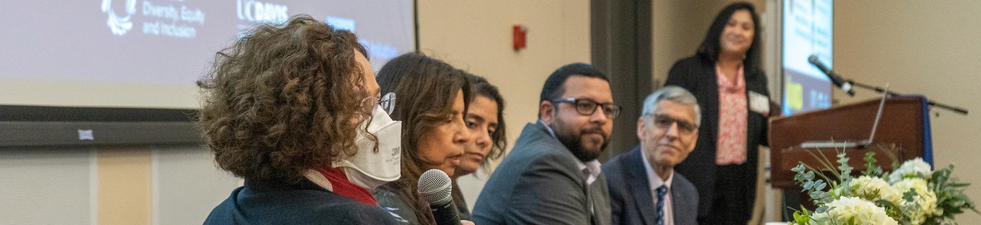 Faculty on a conference panel